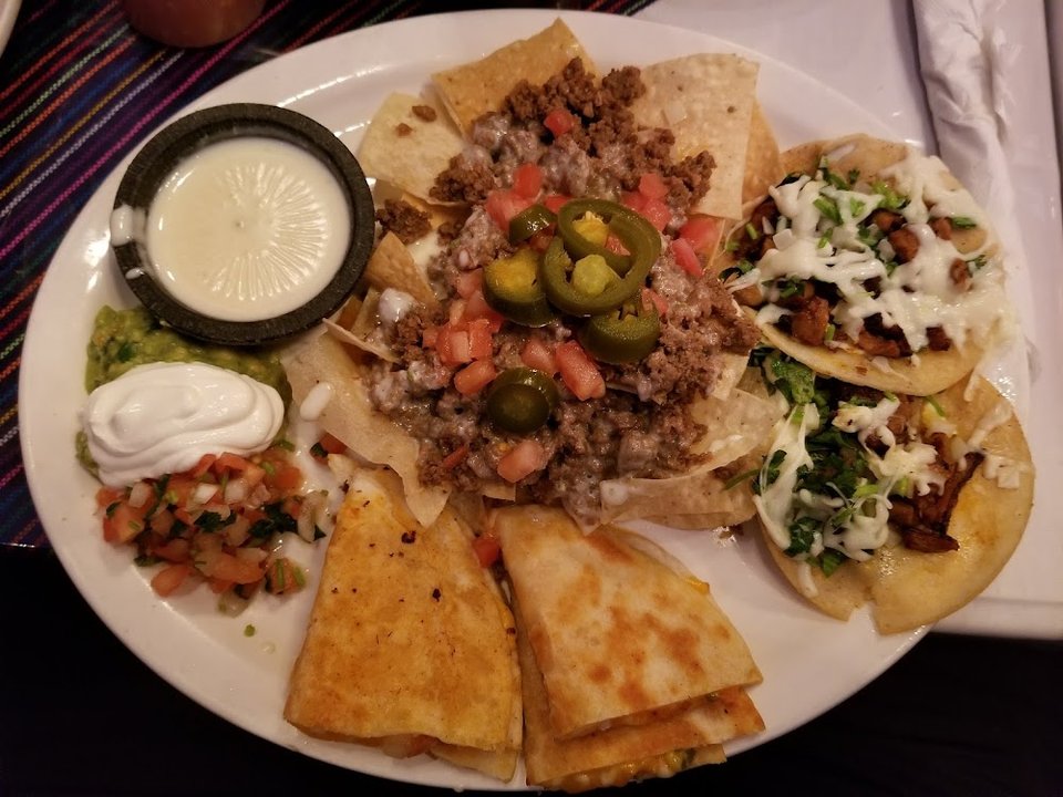 Colorful Mexican dishes on a restaurant table.